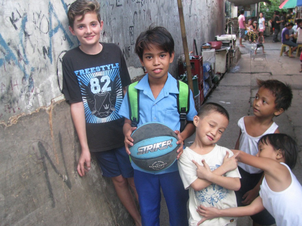 In July this year, eRecord journalist Mark Reidy took his 13-year-old son Joseph (far left) on a mission trip to the Philippines with the Holy Spirit of Freedom Community.  PHOTO: Mark Reidy