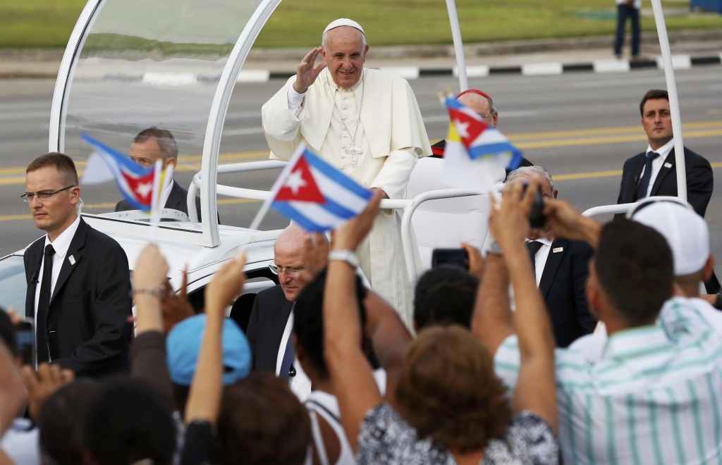 Pope Francis waves to the crowd as he arrives to celebrate Mass in Revolution Square in Havana on 20 September. PHOTO: CNS/Carlos Garcia Rawlins, Reuters