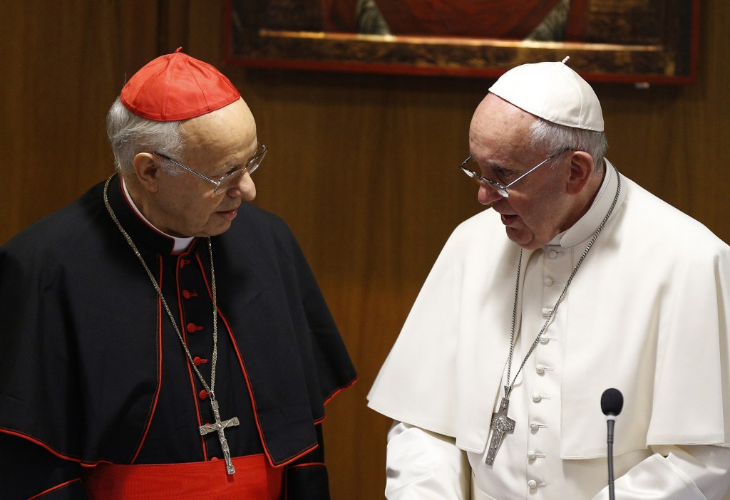 Pope Francis talks with Cardinal Lorenzo Baldisseri, General Secretary of the Synod of Bishops on the family, before a session of the synod at the Vatican on 9 October. PHOTO: CNS/Paul Haring