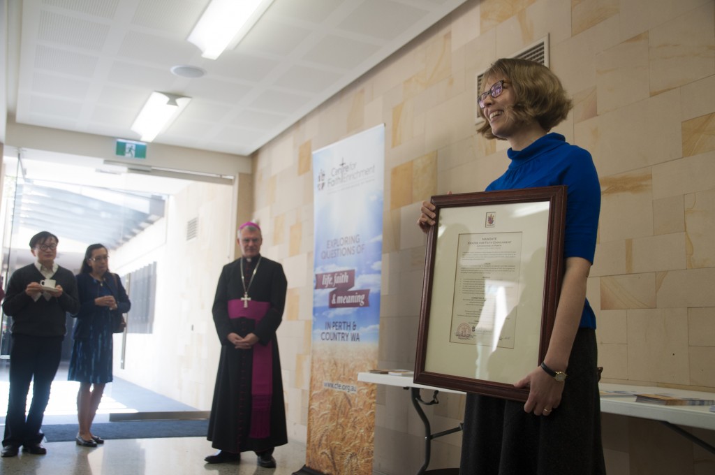 Centre for Faith Enrichment Director Dr Michelle Jones receives the new Mandate from Archbishop Timothy Costelloe on 18 September. PHOTO: Mat De Sousa