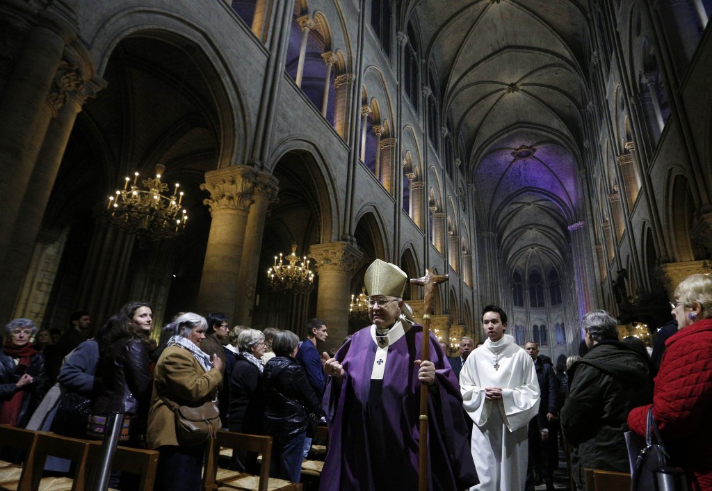 Cardinal Andre Vingt-Trois of Paris leaves in procession after celebrating a Mass in Notre Dame Cathedral in Paris on 15 November to pray for those killed in terrorist attacks. Coordinated attacks the evening of 13 November claimed the lives of 129 people. The Islamic State has claimed responsibility. Photo: CNS/Paul Haring