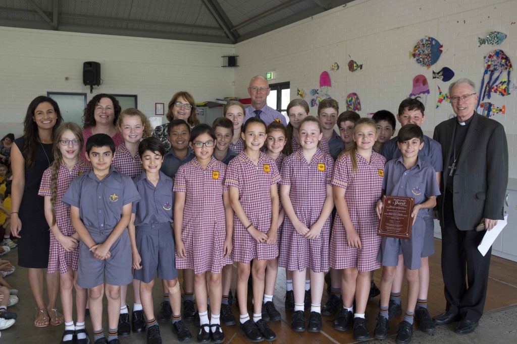 Perth Auxiliary Bishop Don Sproxton with staff and students from Our Lady’s Assumption Primary School Dianella, who were joint recipients of the 2014 Archbishop’s Spirit Award with Trinity College. Bishop Don made a special presentation to OLA staff and students last week, on Thursday, 22 October. Photo: Ron Tan
