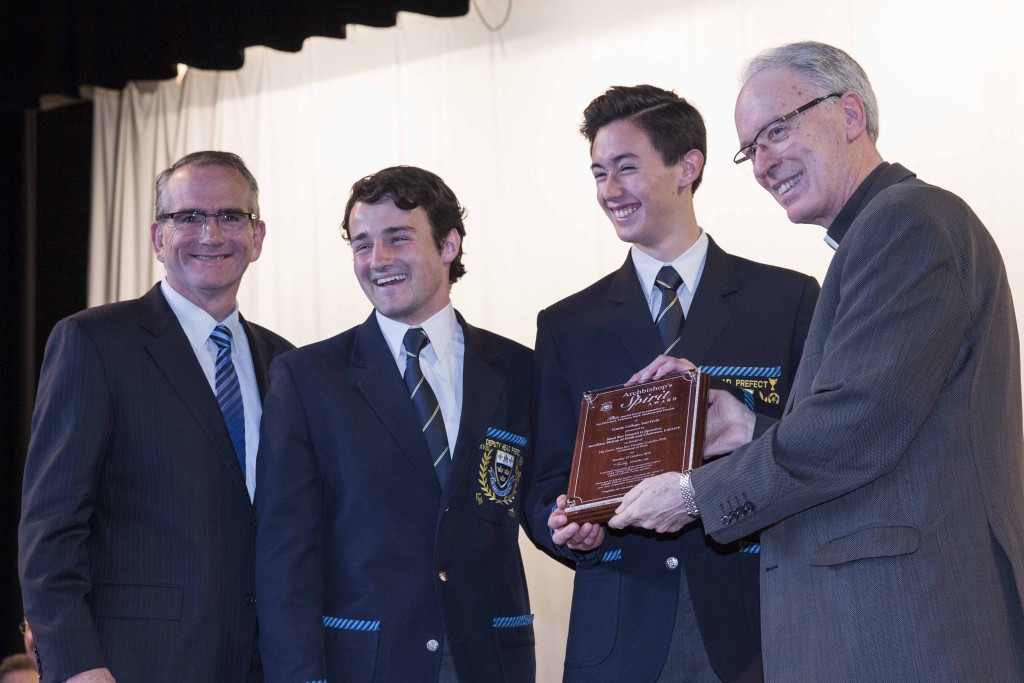 Trinity College Principal Ivan Banks with students, Nick Moulton and Alex Ishida-Livings, and Perth Auxiliary Bishop Don Sproxton, who presented students with a plaque on Tuesday, 27 October as joint recipients of the 2014 Archbishop’s Spirit Award. Photo: Ron Tan