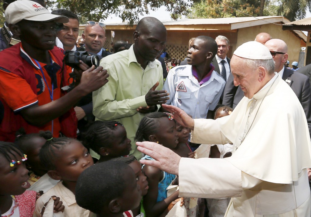 Pope Francis greets children as he visits a refugee camp in Bangui, Central African Republic, on 29 November 2015. Photo: CNS.