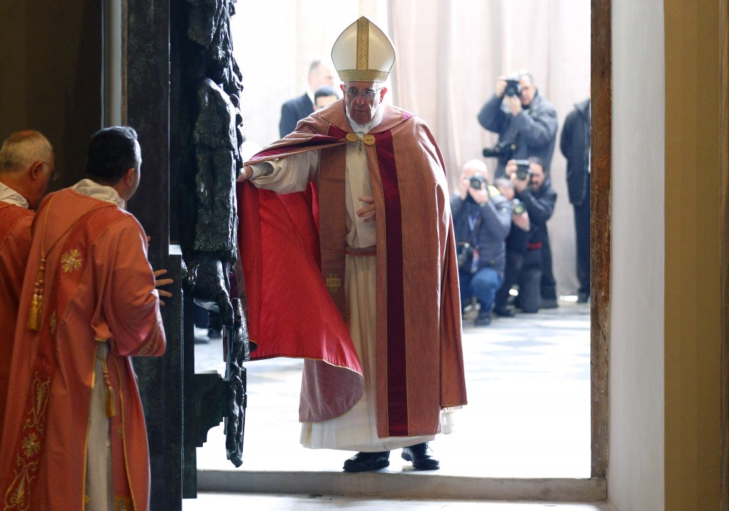 Pope Francis opens the Holy Door of the Basilica of St. John Lateran in Rome on 13 December. Holy doors around the world were opened at city cathedrals, major churches and sanctuaries on 13 December as part of the Jubilee of Mercy. Photo: CNS/Paul Haring.