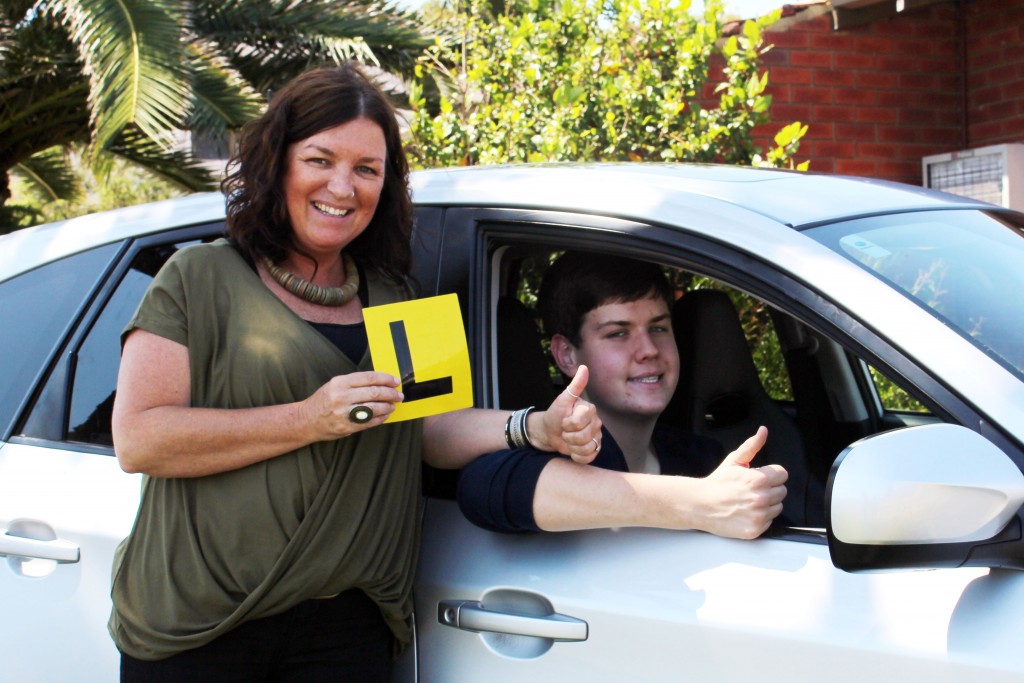 Time to finally hit the road: A newbie L plater, Callan is refining his driving skills with the help of Identitywa Family Support worker, Andrea. Callan hopes to one day drive V8 Super cars. Photo: Supplied