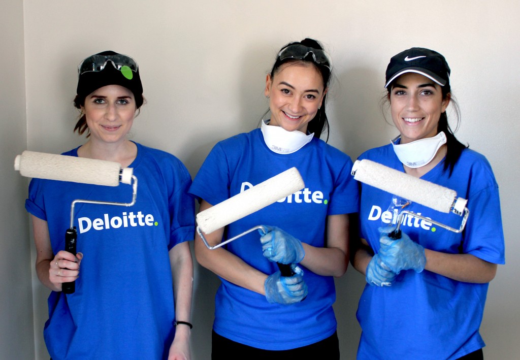 Deloitte Volunteers, from left, Melissa Travers, Jessica Sashegyi and Lucy Carter, have put their painting skills to the test and transformed the inside of MercyCare’s Wembley youth accommodation service, Carlow House, in one day. Photo: Supplied