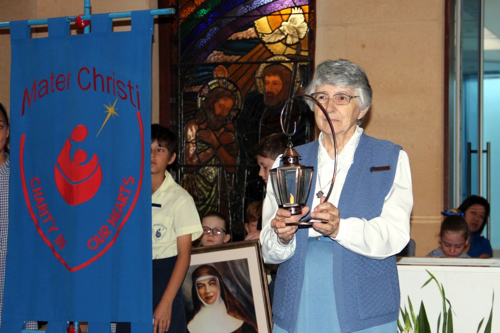 Sr Emmanuel Crocetti bringing forward the lantern representing the work of the Presentation Sisters at Mater Christi Primary School on the occasion of the school’s 25th anniversary last month. Photo: Supplied.