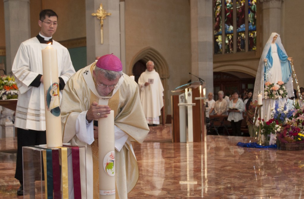 Archbishop Timothy Costelloe extinguishes the candle ending Year of Consecrated Life. Photo: Marco Ceccarelli.