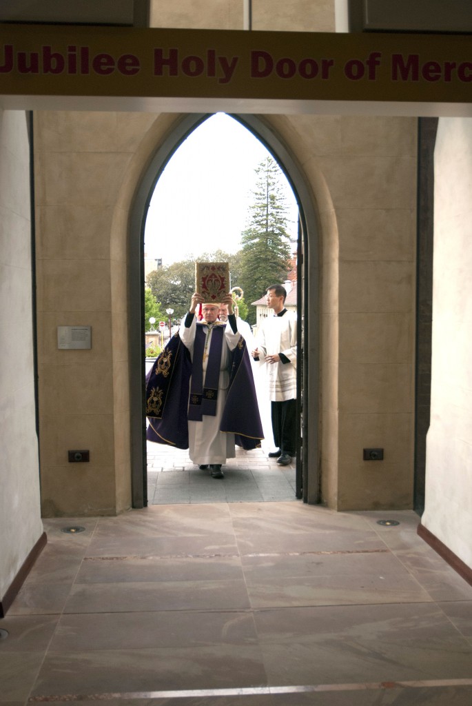 Archbishop Costelloe walks through the Holy Door at St Mary’s Cathedral on Saturday, 12 December, marking the commencement of the Jubilee Year of Mercy. Photo: Jamie O’Brien
