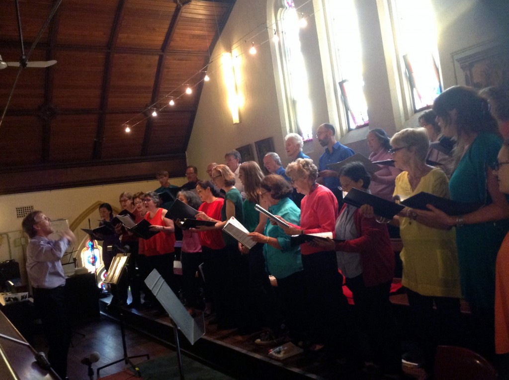 Choir director John Kinder guides the St Thomas choir in song at The Road to Bethlehem Advent liturgy held on 7 December 2015 at the St Thomas the Apostle Parish, Claremont. Photo: Supplied