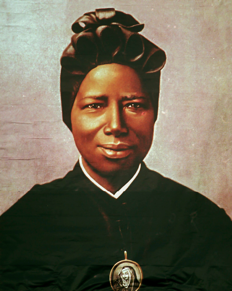 A tapestry portrait of St Josephine Bakhita, an African slave who died in 1947, hangs from the facade of St Peter's Basilica during her canonisation in 2000 at the Vatican. St Bakhita was born in the Darfur region of what is now Sudan. Photo: CNS/L'Osservatore Romano via Reuters.