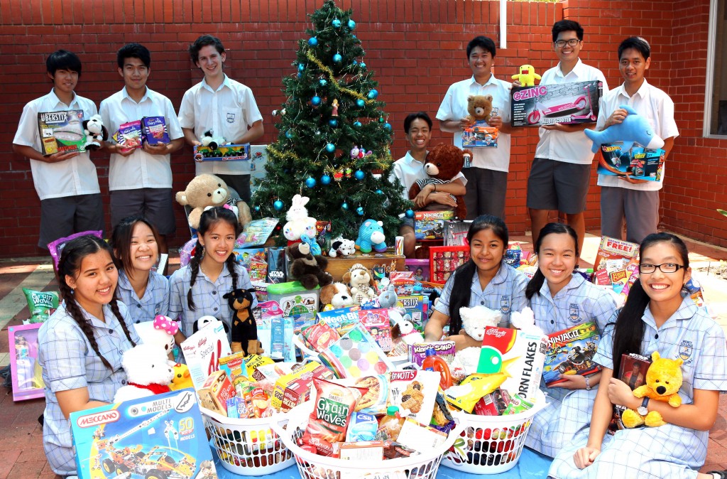 Mercy College students with food items and toys collected for the PaMaChi, a group that offers financial aid to grandparents in full-time care of their grandchildren. Photo: Supplied