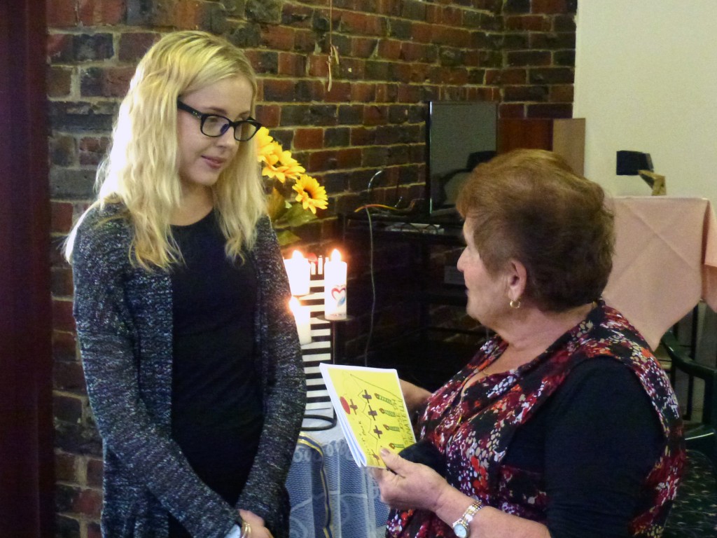 Proud recipient of the Catholic Women’s League 2015 scholarship, Amy Bradley, receives a small gift from Manjimup member, Connie Femia, at the Catholic Women’s League WA Annual conference in October 2015. Photo: Supplied