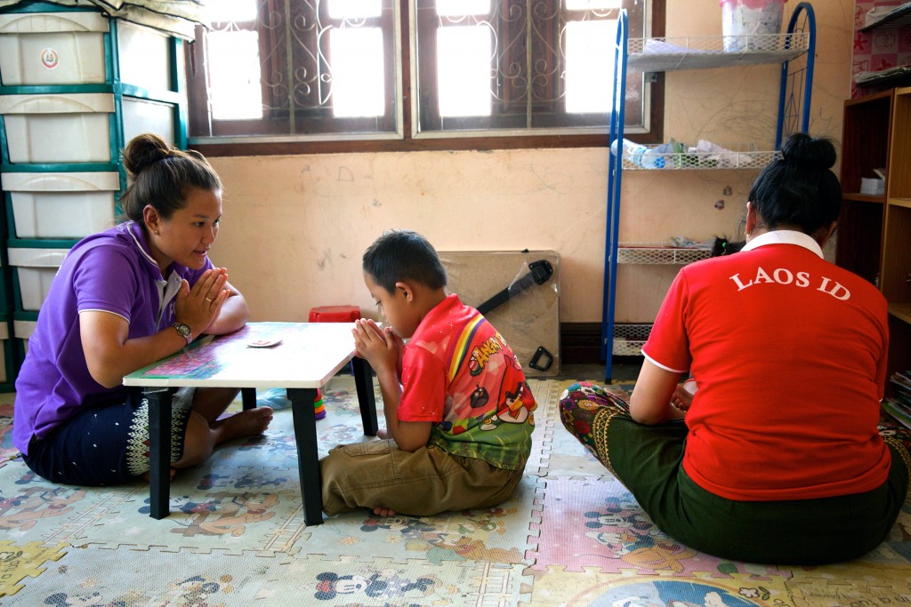 Hum Noy with one of his teachers at the specialist school for children with an intellectual disability, supported by Caritas Australia. Photo: Richard Wainwright