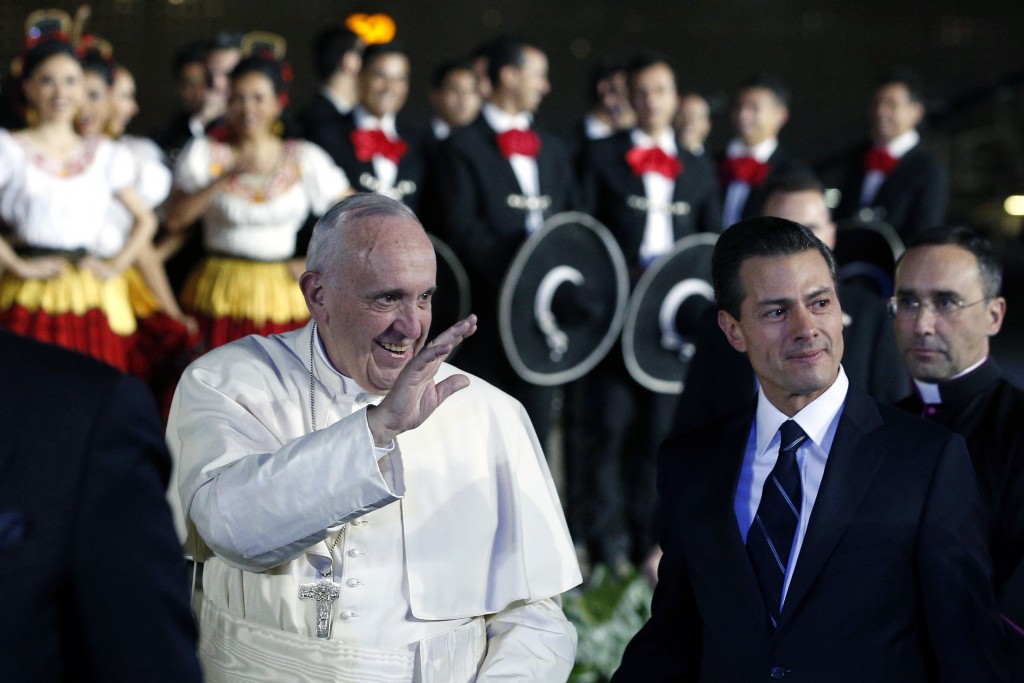 Pope Francis walks with Mexican President Enrique Pena Nieto during a welcoming ceremony at Benito Juarez International Airport in Mexico City on 12 February. Photo: CNS