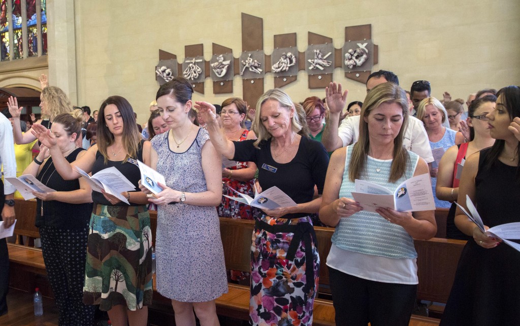 The congregation are asked to bless new staff members during the Catholic Education WA Commissioning Mass at St Mary’s Cathedral on 16 February. Photo: Ron Tan