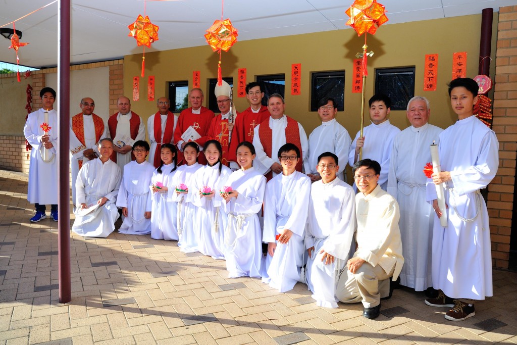 Auxiliary Bishop Don Sproxton, pictured with co-celebrants and altar servers, is all smiles after the thanksgiving Mass to celebrate the Chinese New Year. Photo: Supplied