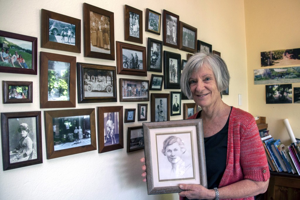 Granddaughter of talented Perth artist Margaret Gordon Johnson holds a self-portrait of her grandmother in her Floreat home. Photo: Marco Ceccarelli.