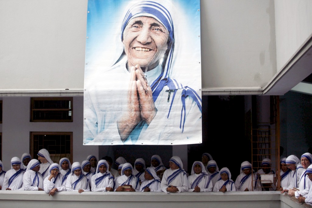 A poster of Blessed Teresa of Kolkata and Missionaries of Charity is seen in Kolkata, India, in this 5 September 2007 file photo. Pope Francis will declare her a saint at the Vatican on 4 September. Photo: CNS/Jayanta Shaw, Reuters