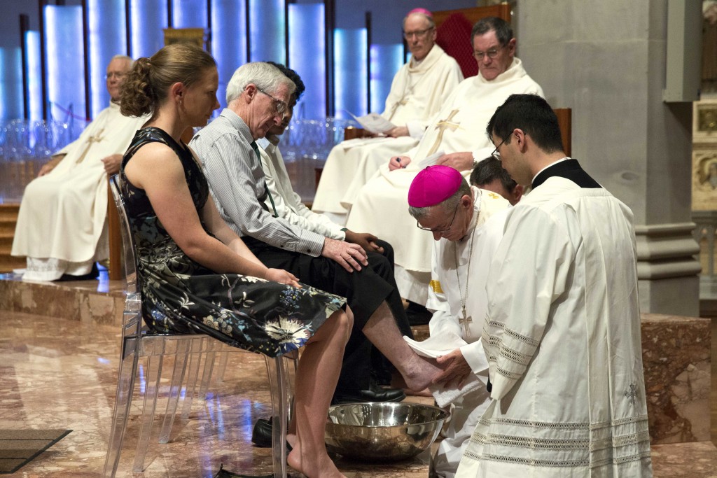 Archbishop Costelloe washes the feet of a member of the congregation at the Holy Thursday Mass on 24 March at St Mary’s Cathedral. Photo: Ron Tan.