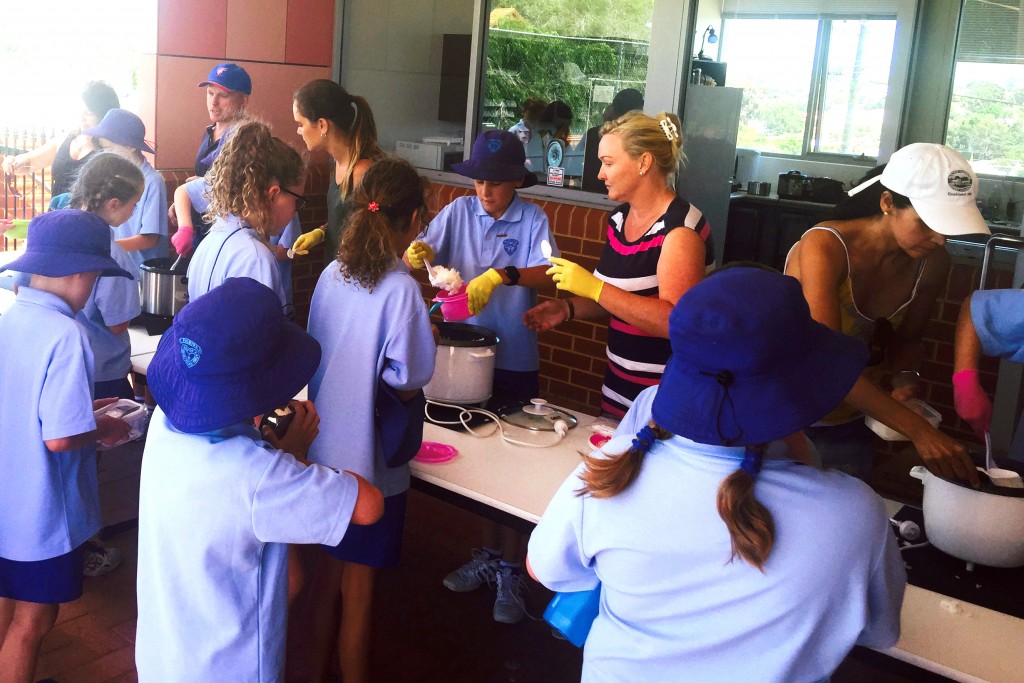 Our Lady of Fatima parent helpers work together with the Year 6 leadership group to make sure everything runs smoothly at the Rice Days. Photo: Supplied