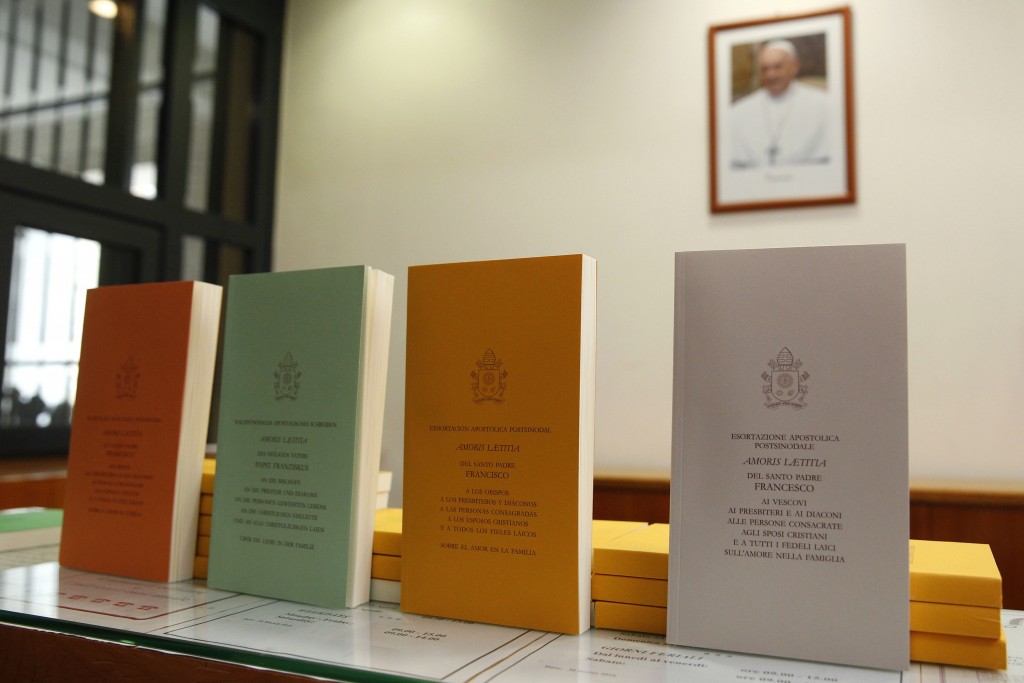 Copies of Pope Francis' apostolic exhortation on the family, ‘Amoris Laetitia’ are seen during the document's release at the Vatican on 8 April. The exhortation is the concluding document of the 2014 and 2015 synods of bishops on the family. Photo: CNS/Paul Haring.