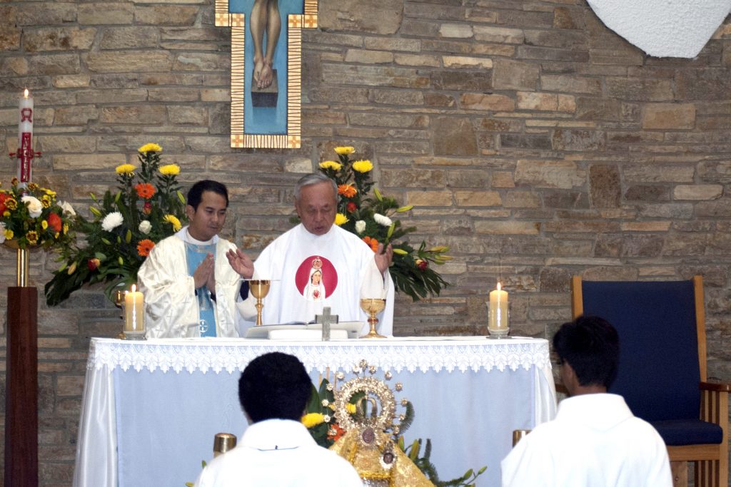 Fathers Jeffey Casabuena and Francis Ly lead the Mass at Maida Vale’s Flores de Mayo celebration. Photo: Caroline Smith