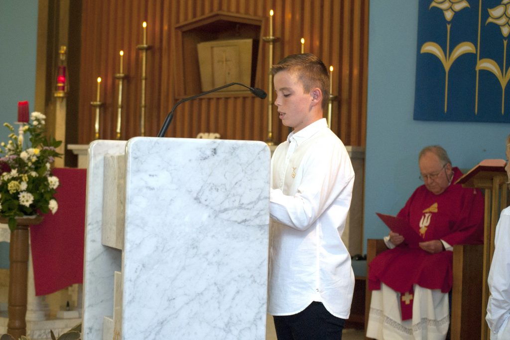 Finn McIntyre completes a reading during the First Communion Mass at East Fremantle parish. Photo: Rachel Curry