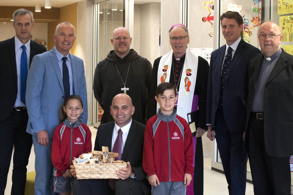 State Member for Darling Range Tony Simpson, Catholic Education WA Executive Director Tim McDonald, Abbot of New Norcia Fr John Herbert OSB, Auxiliary Bishop Don Sproxton, Federal Member for Canning Andrew Hastie and Armadale Parish Priest Fr Kaz Stuglik (back) with Salvado Catholic College Principal Santino Giancono and students (front). Photo: Rachel Curry.