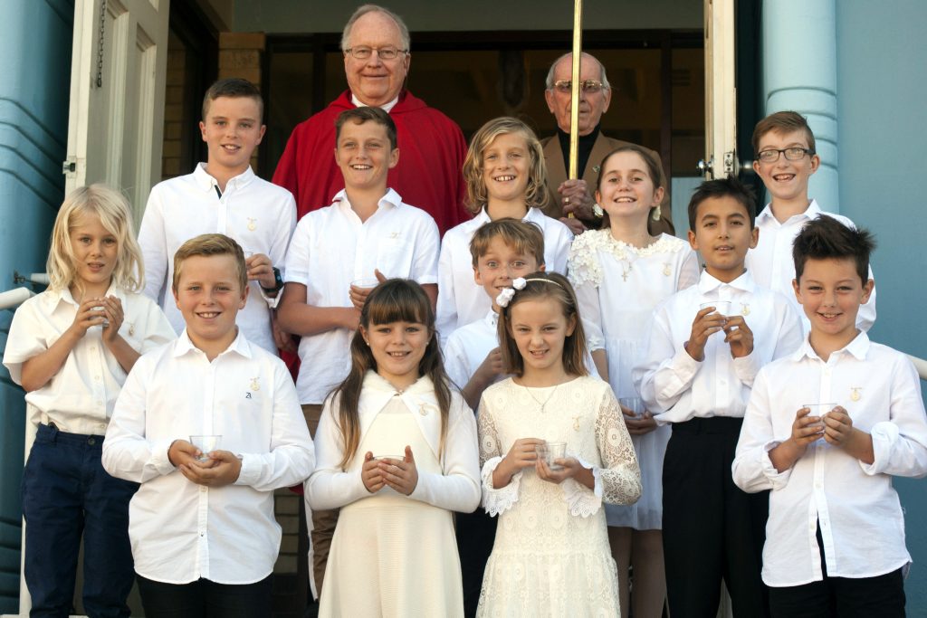 The 12 children are all smiles after making their First Holy Communion at East Fremantle parish, the first group to do so in 15 years. Photo: Rachel Curry