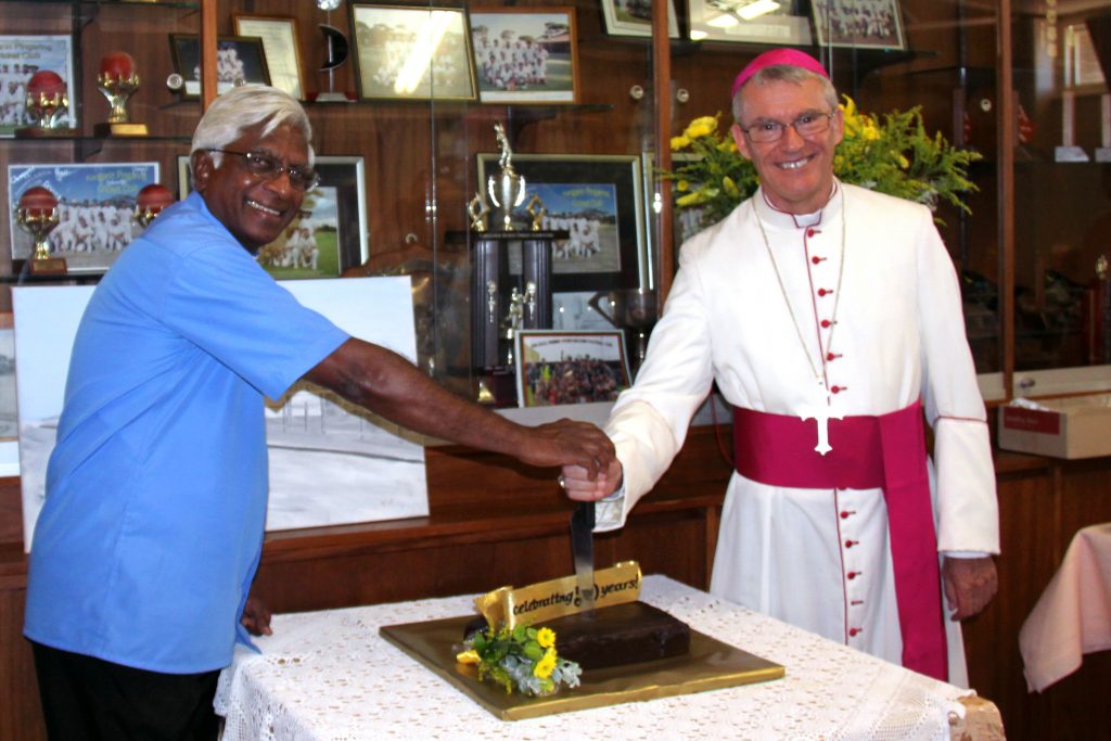 Archbishop Timothy Costelloe recently visited the newly restored Our Lady Help of Christians Church in Karlgarin three years after a devastating storm crippled the building. He is pictured with Parish Priest Father Sebastian Fernando cutting the cake to celebrate the 50th anniversary of the Church. Photo: Supplied