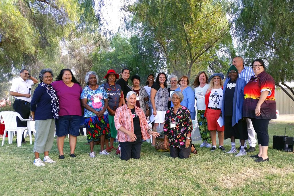 Aboriginal women pose for a photo at Blatherskite Park during the NATSICC Spirituality and Formation Retreat in Alice Springs. Photo: Supplied