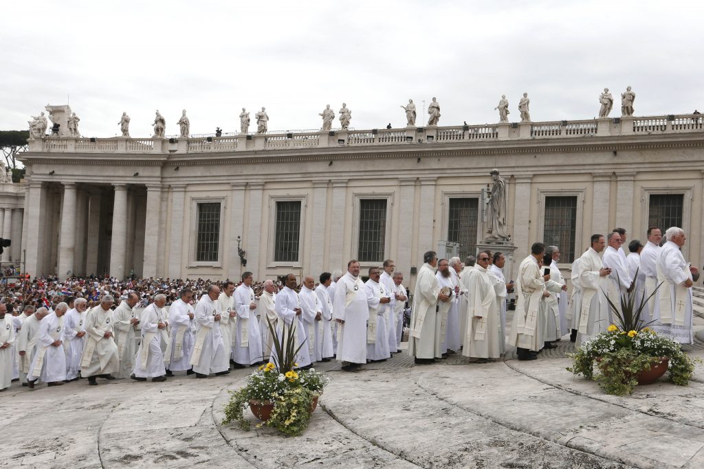 Deacons process to their seats near the altar as they arrive for Pope Francis' celebration of a Mass for the Jubilee of Deacons in St Peter's Square at the Vatican on May 29. The Mass was a celebration of the Holy Year of Mercy. Photo: CNS/Paul Haring.