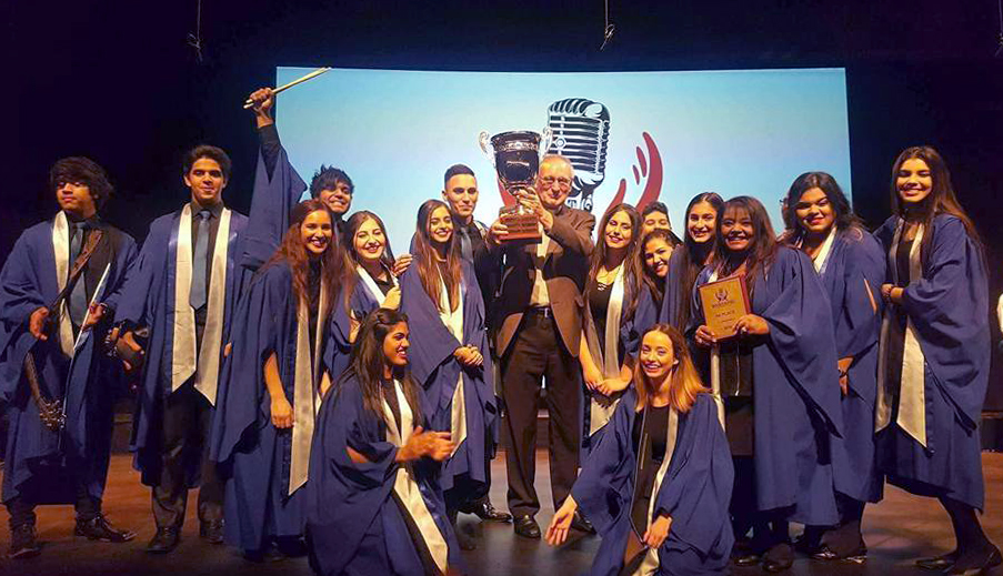 As proud winners of the prestigious GoGospel Clash of the Choirs Competition, the Sacred Heart Thornlie Choir posed in front of its trophy at His Majesty’s Theatre on 11 June. Photo: Supplied