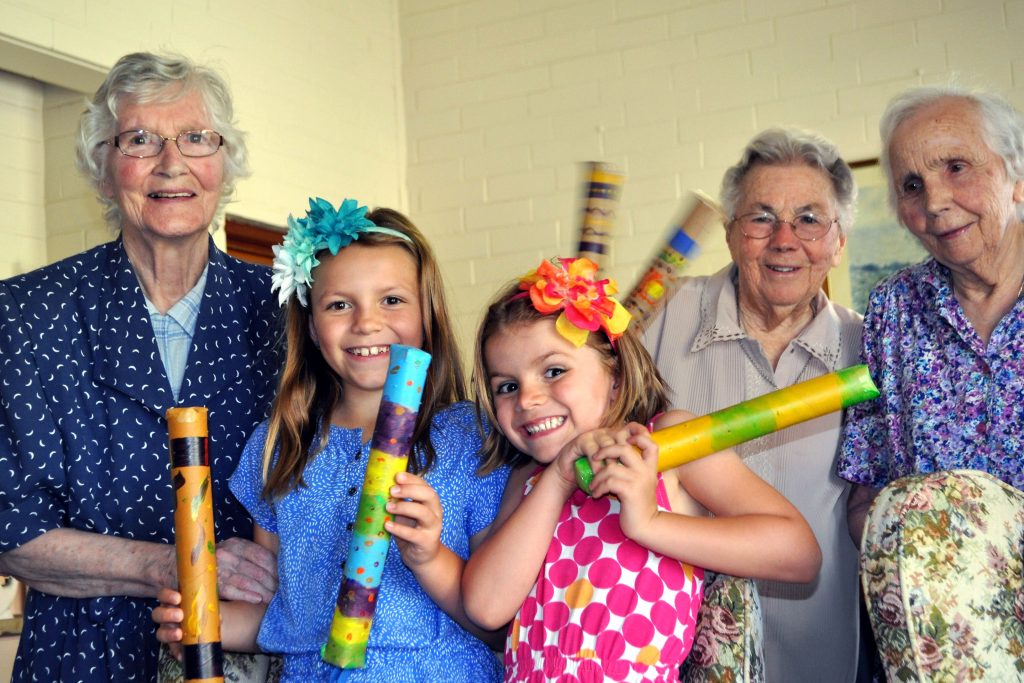 Seniors at Mercy Health’s Mercyville Hostel in Craigie have teamed up with local children to entice summer showers by making rain sticks which, in many ancient cultures, represent the patter of rain when they are shaken. Photo: Supplied