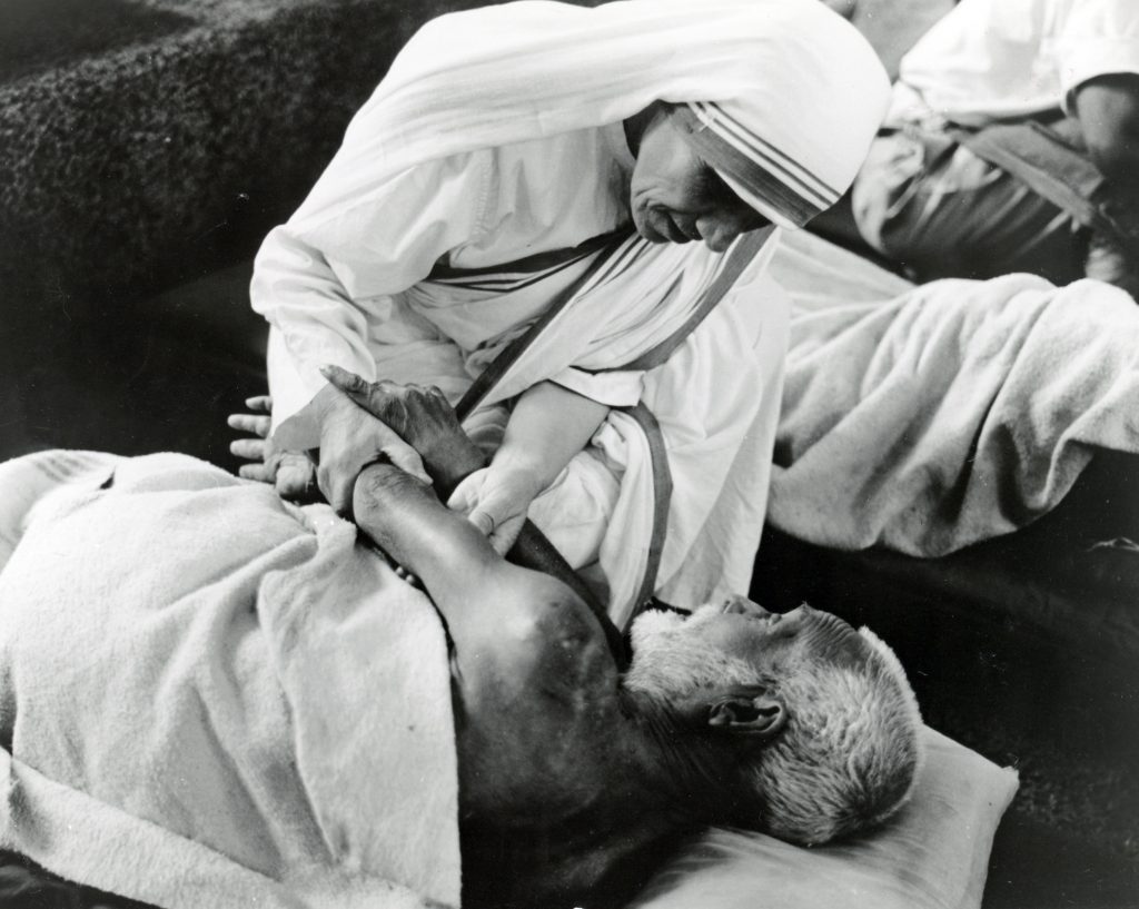 Blessed Teresa of Kolkata cares for a sick man in an undated photo. Pope Francis will declare Blessed Teresa a saint at the Vatican on 4 September. Photo: CNS/KNA