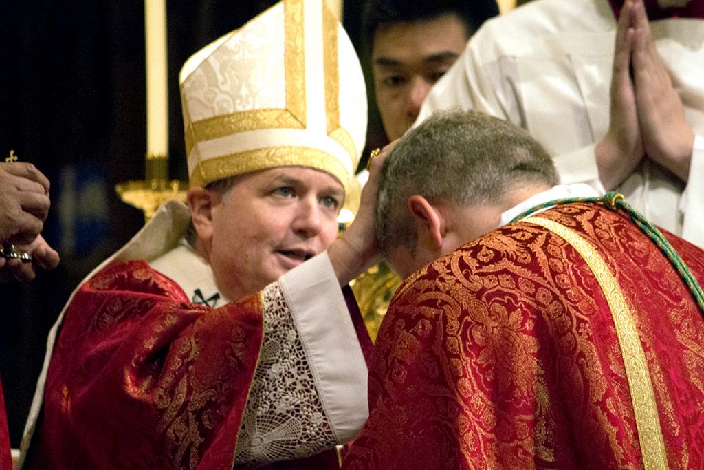 Archbishop Anthony Fisher OP anoints the head of newly ordained Bishop Richard Umbers. Photo: Sourced