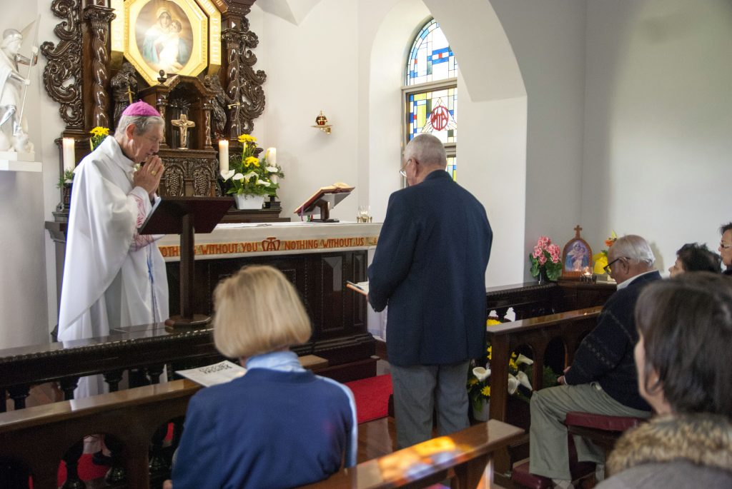 Trevor Knuckey makes private vows in front of Emeritus Archbishop Barry Hickey at the Schoenstatt Shrine on Monday, 15 August. Photo: Rachel Curry