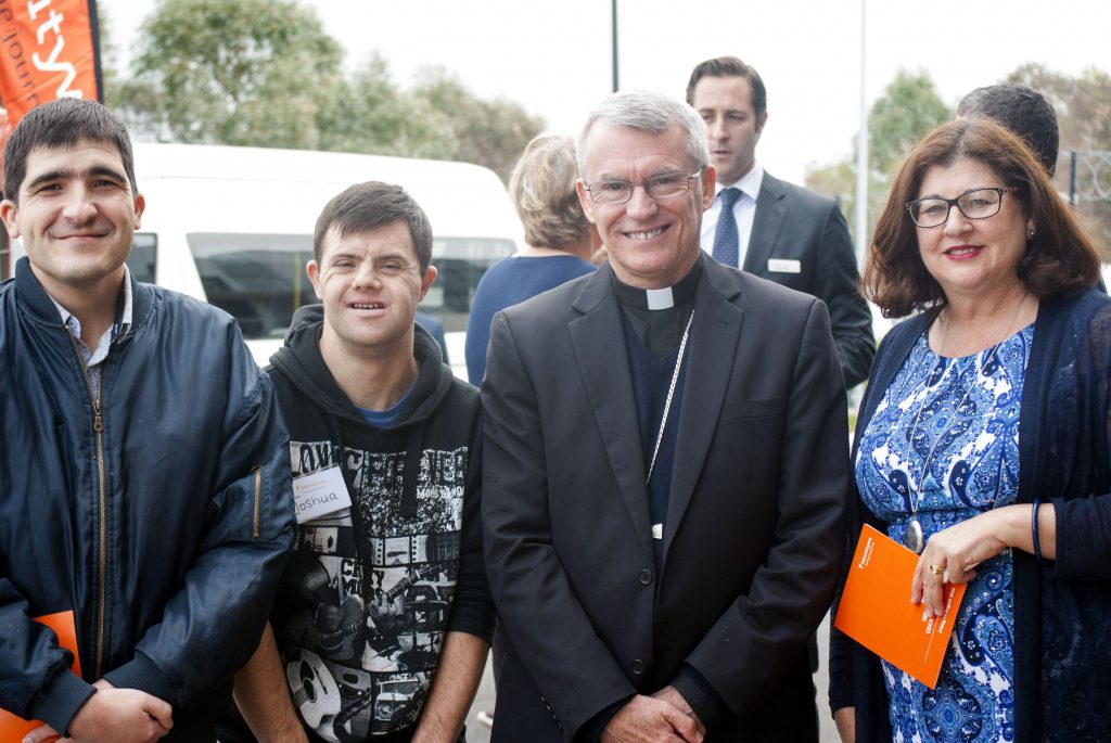 Simon and Joshua, who are supported by Identitywa, with Perth Archbishop Timothy Costelloe SDB and Identitywa CEO Marina Re, celebrate the opening of the new Cockburn office. Photo: Rachel Curry
