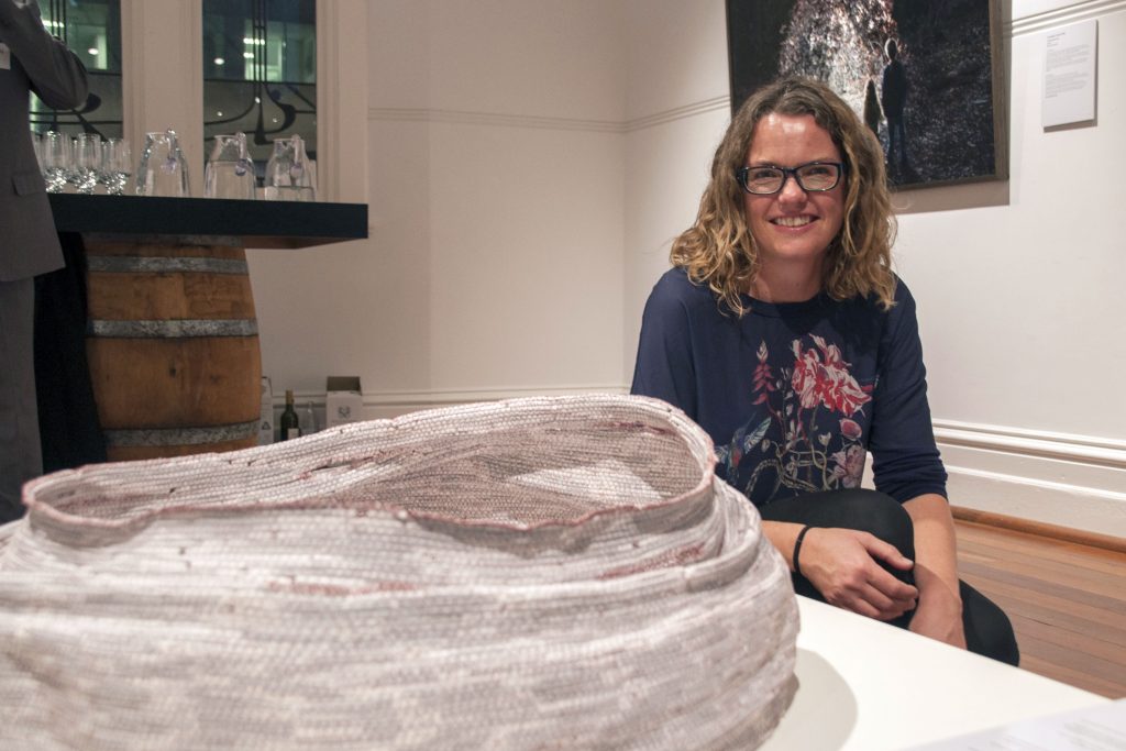Megan Robert was awarded the acquisitive St John of God Health Care Prize at this year’s Mandorla Art Award. She is pictured with her work titled The Bread Basket at Emmaus – then Flesh returned to Word. Photo: Marco Ceccarelli
