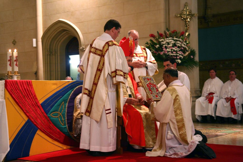 Deacon Trevor Lyra accepts the book of Gospels during his ordination to the Diaconate on 29 June 2006. Deacon Trevor celebrated his 10 year anniversary as a Deacon this year, together with 12 other men who were ordained to the Permanent Diaconate on 29 June 2006. Photo: Jamie O’Brien