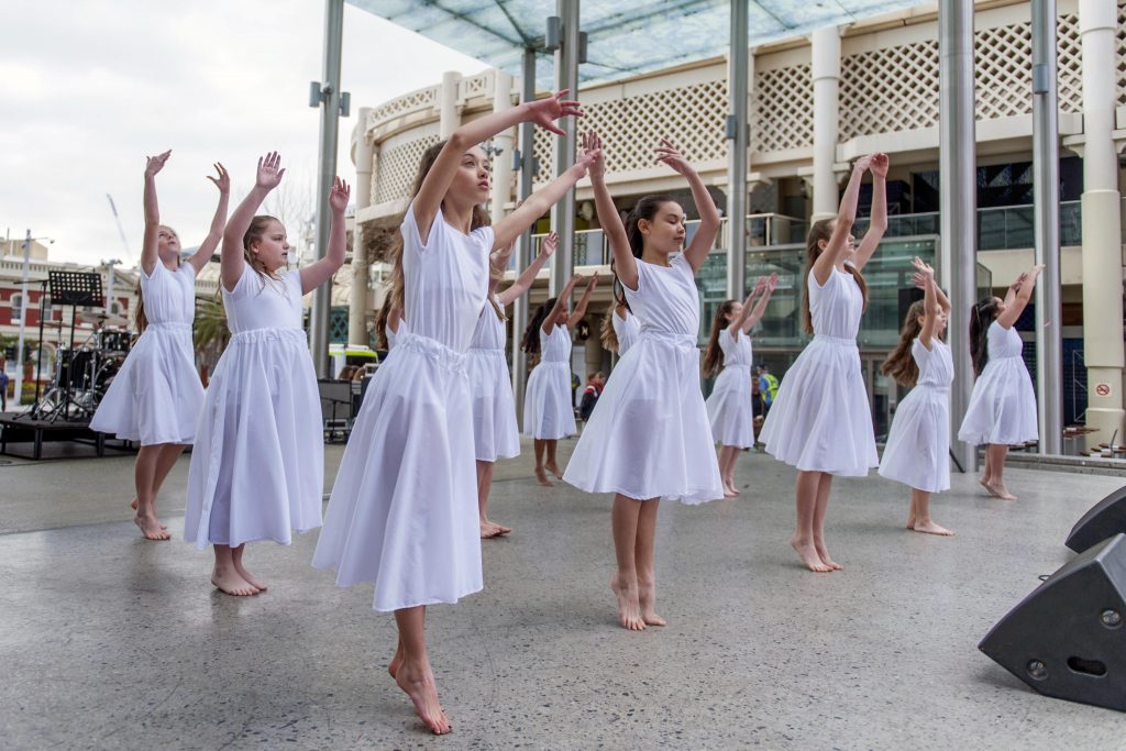 The Whitford Catholic Primary School Liturgical Dancers, who participated in the Performing Arts Festival for Catholic Schools and Colleges, perform at the associated Carnevale event on 8 September. Photo: Supplied