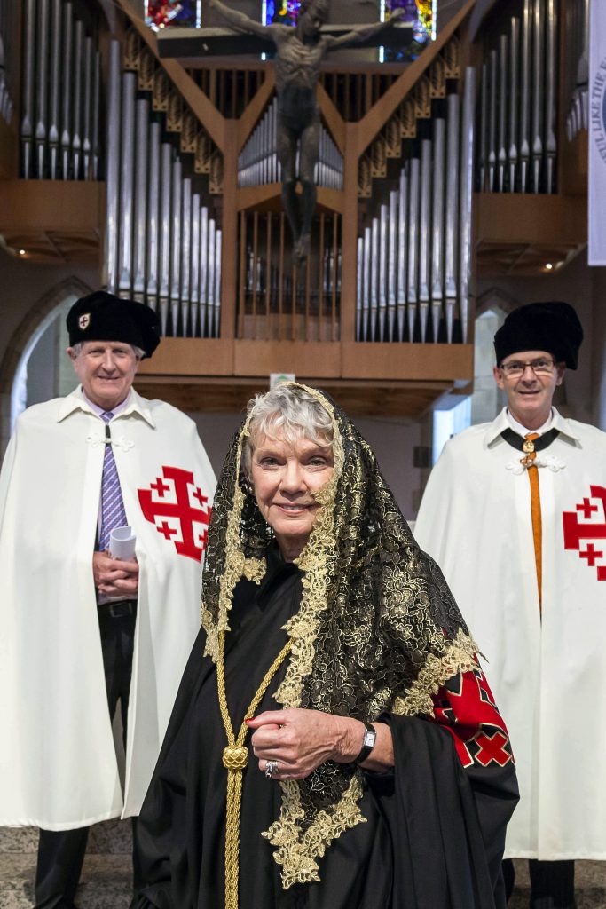 The first female Lieutenant of the Queensland Lieutenancy, Dr Monica Thomson, added a black cape and a gold mantilla to her hooded robes to distinguish herself as the new chapter leader. Photo: Alan Edgecomb/The Catholic Leader