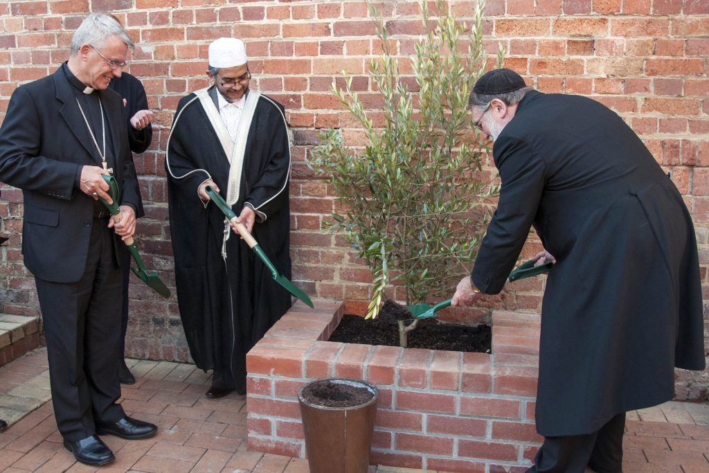 The leaders of the three Abrahamic faiths, Christianity, Judaism and Islam, planted an olive tree, a symbol of peace, in Notre Dame University’s Malloy Courtyard. Photo: Marco Ceccarelli