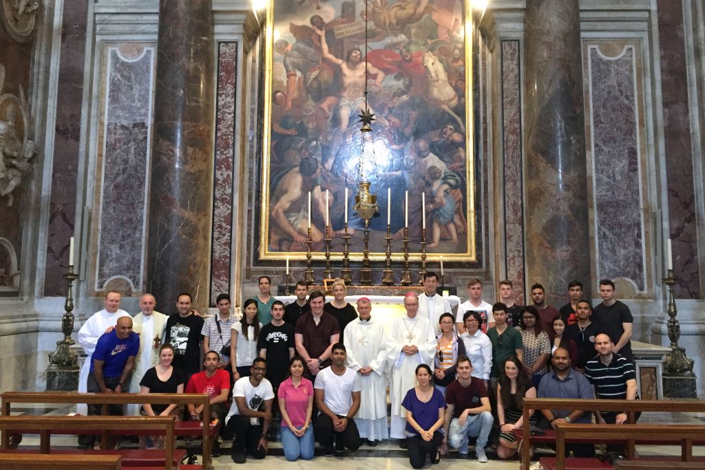 Pilgrims celebrated Mass at the tomb of St John Paul II, in St Peter’s Basilica, on their way to Krakow for World Youth Day. Photo: Supplied