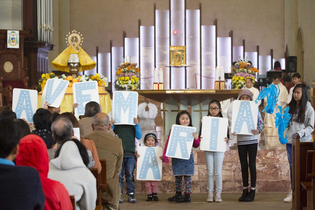 Children hold letters spelling “Ave Maria” during the Mass for the Feast of Our Lady of Penafrancia at St Mary’s Cathedral on Saturday, 17 September. Photo: Ron Tan