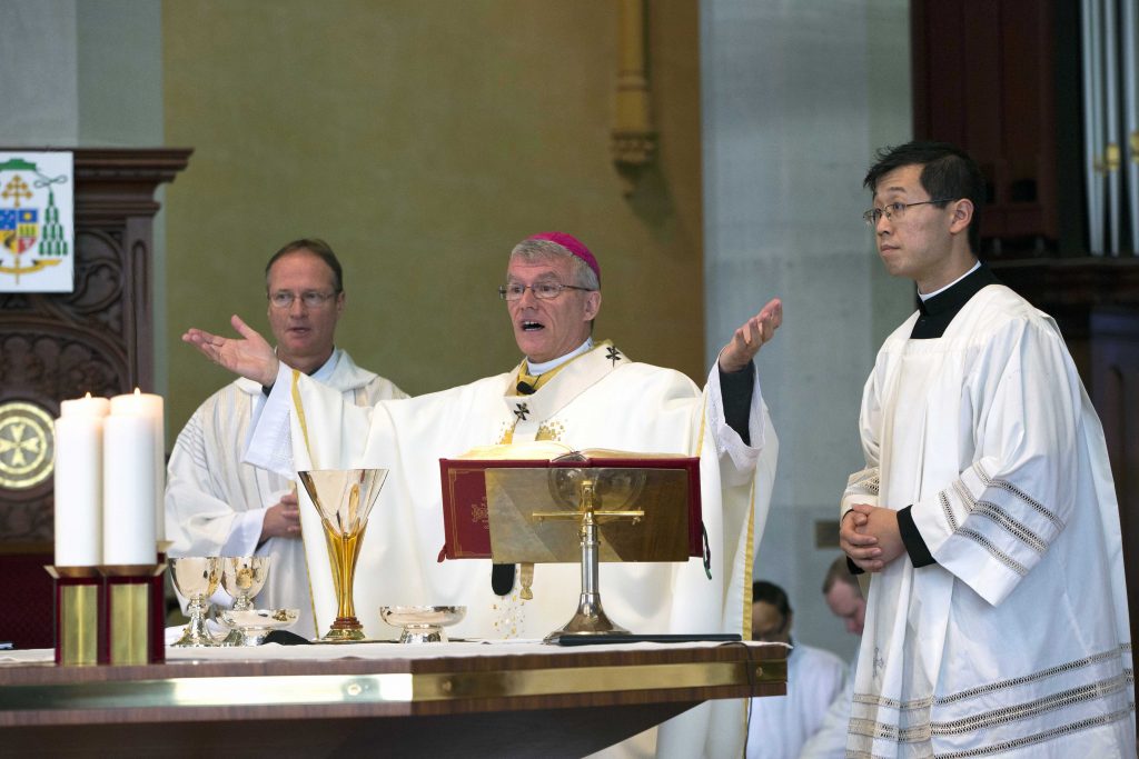 Deacon Greg Lowe, Archbishop Timothy Costelloe and Father Brennan Sia (MC) during the annual Eucharistic Celebration for Church Agency Personnel at St Mary’s Cathedral on Thursday, 20 September. Photo: Ron Tan