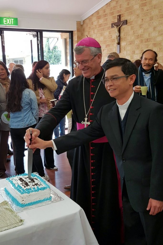 Archbishop Timothy Costelloe SDB and Father Michael Quynh Do, pictured with Cloverdale parishioners, after the Installation Mass at the Church of Notre Dame. Photo: Supplied