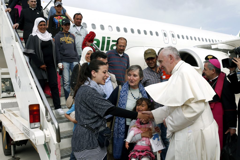 Pope Francis greets Syrian refugees he brought to Rome from the Greek island of Lesbos, at Ciampino airport in Rome in April 2016. Archbishop Hart underscored Pope Francis’ call on Catholics to welcome such vulnerable people as our brothers and sisters. Photo: CNS/Paul Haring
